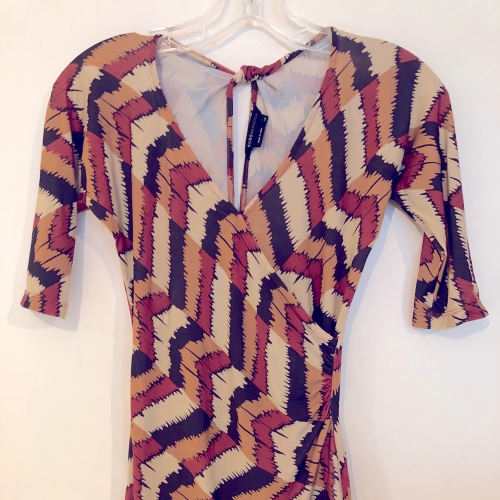 BCBGMaxazria twist back hole top